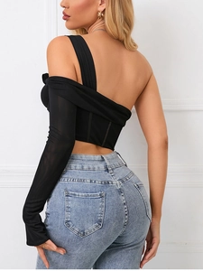 Detail of black asymmetric mesh sleeve top with boning structure and sheer texture