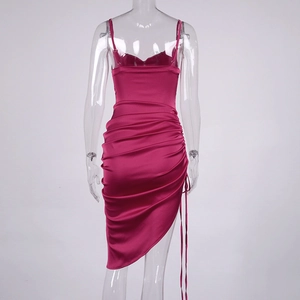 Detailed back view of magenta satin dress showing lace-up back and elegant side ruching