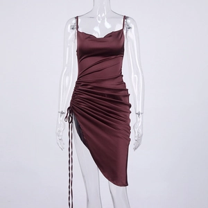 Detailed view of wine red satin dress showing side drawstring ruching and slit design