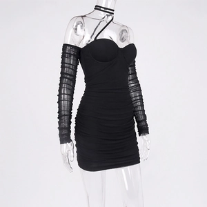 Close-up of ruched mesh texture and layered gathering on black bodycon mini dress
