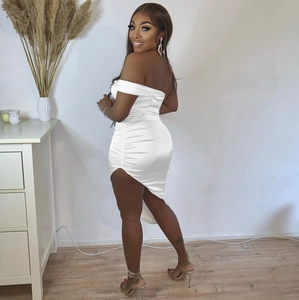 Detailed side view of white ruched satin dress with sexy high slit and open back design
