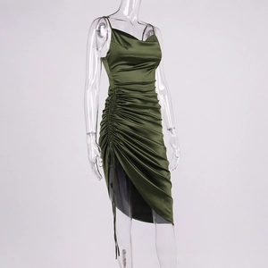 Detail of emerald green satin slip dress featuring ruched drawstring and side slit