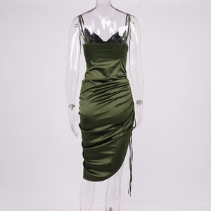 Detail of dark green satin slip dress featuring drawstring ruching and a side slit design