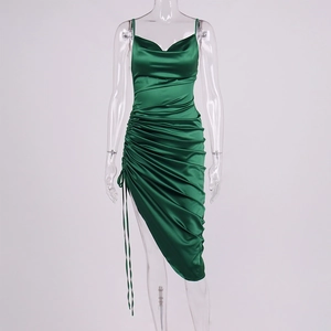 Detailed view of dark green satin dress with side drawstring ruched texture and silk fabric