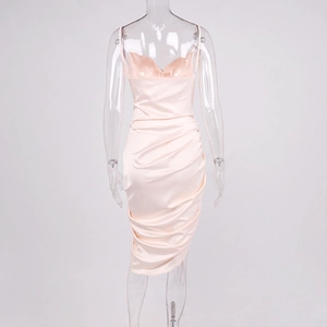 Detailed back view of peach satin slip dress with elegant draped pleats and thin straps