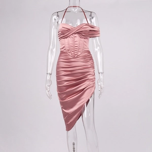 Detail view of pink satin corset dress with elegant draping and asymmetrical hemline