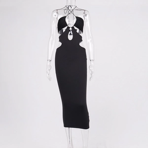 Detailed view of the black halter dress with hollow waist cut-outs and pleated texture