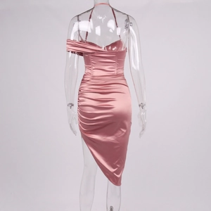 Back view of pink satin midi dress featuring ruched details and an asymmetric slit hemline