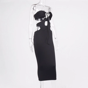 Detail of black cutout dress featuring waist hollow-outs and tie-up front design