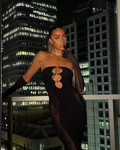 Detail of black strapless mini dress with rhinestone cut-outs and sheer mesh panels