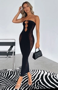 Detail of black strapless mini dress with mesh patchwork and rhinestone hollow cut-outs