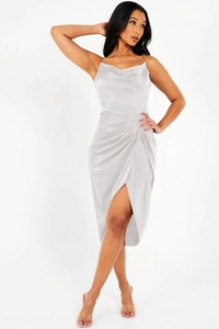 Close-up of champagne satin midi dress featuring elegant chain straps and high side slit