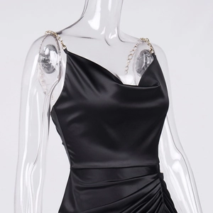 Elegant black satin slip dress with gold chain straps and a stylish draped cowl neck