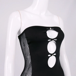 Detail of mesh side panels and rhinestone cutout on black bodycon dress