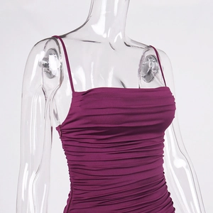 Close-up of the wine red ruched fabric texture and slim fit design on a strap dress