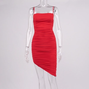 Detail of red ruched mini dress with thin straps and asymmetrical hemline design