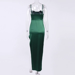 Detail of the back of a dark green satin maxi dress with thin straps and hidden zipper