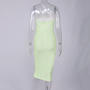 Back view of bodycon midi dress in lime green mesh with back zipper and white straps