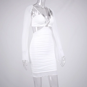 Detailed view of white ruched bodycon skirt with sheer mesh shrug and cross straps