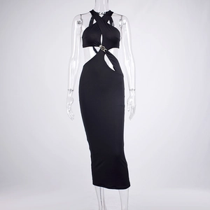 Detail of black halter maxi dress featuring waist cut-outs and metal ring connectors