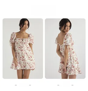 Front and back view of a floral mini dress with puff sleeves and drawstring square neck