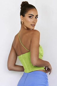 Detail view of lime green corset top with boning structure and hidden back zipper