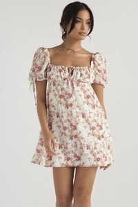 Detail of floral mini dress with puff sleeves, square neck and drawstring bust detail