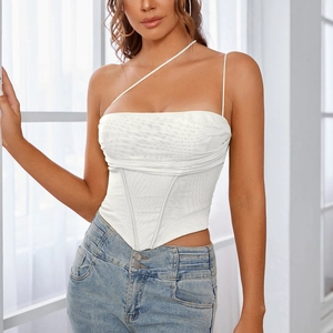 Detail of white asymmetric corset top featuring fishbone support and ruched mesh fabric