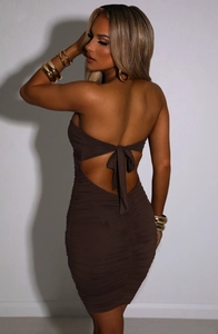 Detail of ruched coffee tube dress featuring a low back design with tie-up bow closure