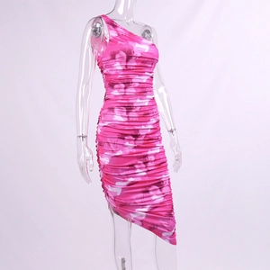 Detail of pink abstract print ruched dress with one-shoulder and asymmetrical hem