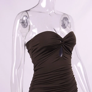Detail view of the twisted knot and hollow-out design on a brown bodycon tube dress