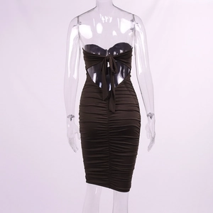 Detail of ruched dark brown bodycon dress showing back cutout and bow-tie lace-up
