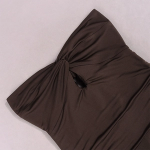 Detail of coffee brown tube dress featuring front twist knot and teardrop cutout