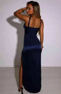 Detail of navy satin maxi dress featuring corset back design and high side slit