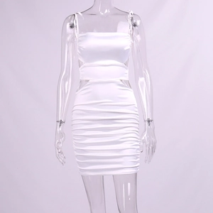 Detail of white satin mini dress with side cut-outs and gathered ruched fabric textures