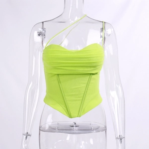 Detailed close-up of neon green corset top with asymmetrical straps and heart neckline