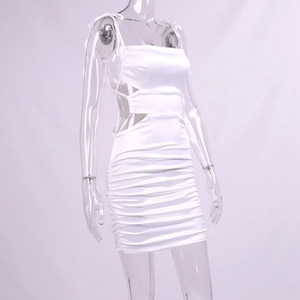 Detail view of white ruched satin mini dress with side cut-outs and bow straps