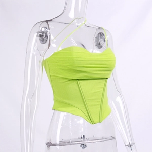 Detail of neon green mesh corset top featuring pleated chest and structured boning