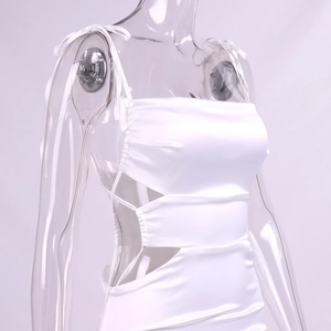 Detail of white satin dress with elegant shoulder ties and waist cutout design