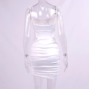 Detailed back view of white ruched satin mini dress featuring sexy cutout and slim fit style