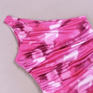 Detail of ruched pink and purple abstract print fabric with one-shoulder design