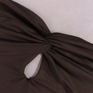 Close-up of chocolate brown knit dress featuring twist knot and cutout center details