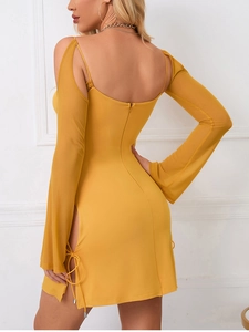Detailed back view of a slim ginger dress featuring mesh long sleeves and side drawstring