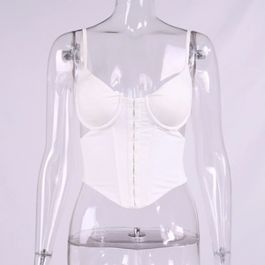Detailed front view of white corset top featuring adjustable straps and hook-and-eye closure
