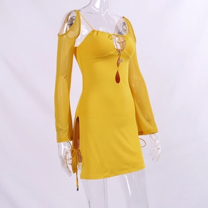 Detail of ginger long sleeve dress with mesh cutouts, keyhole neck, and drawstring slits