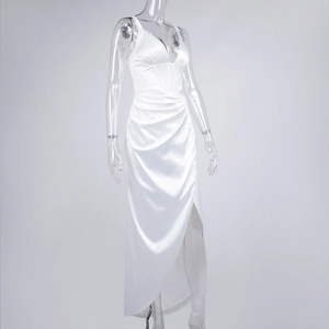 Detail view of white satin corset maxi dress with V-neckline and high leg slit