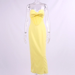 Detail of lemon yellow corset dress featuring a twisted knot bodice and boning structure