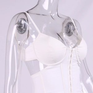 Slim fit white corset crop top with hook-and-eye closure and spaghetti straps