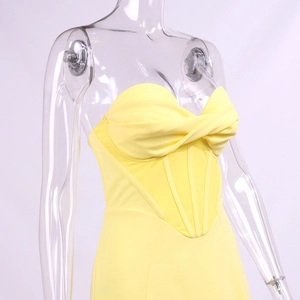 Detailed front view of a yellow corset dress featuring bone support and knotted bust detail
