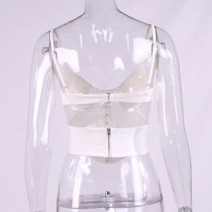 Close-up of white corset top featuring adjustable back straps and a metal zipper closure